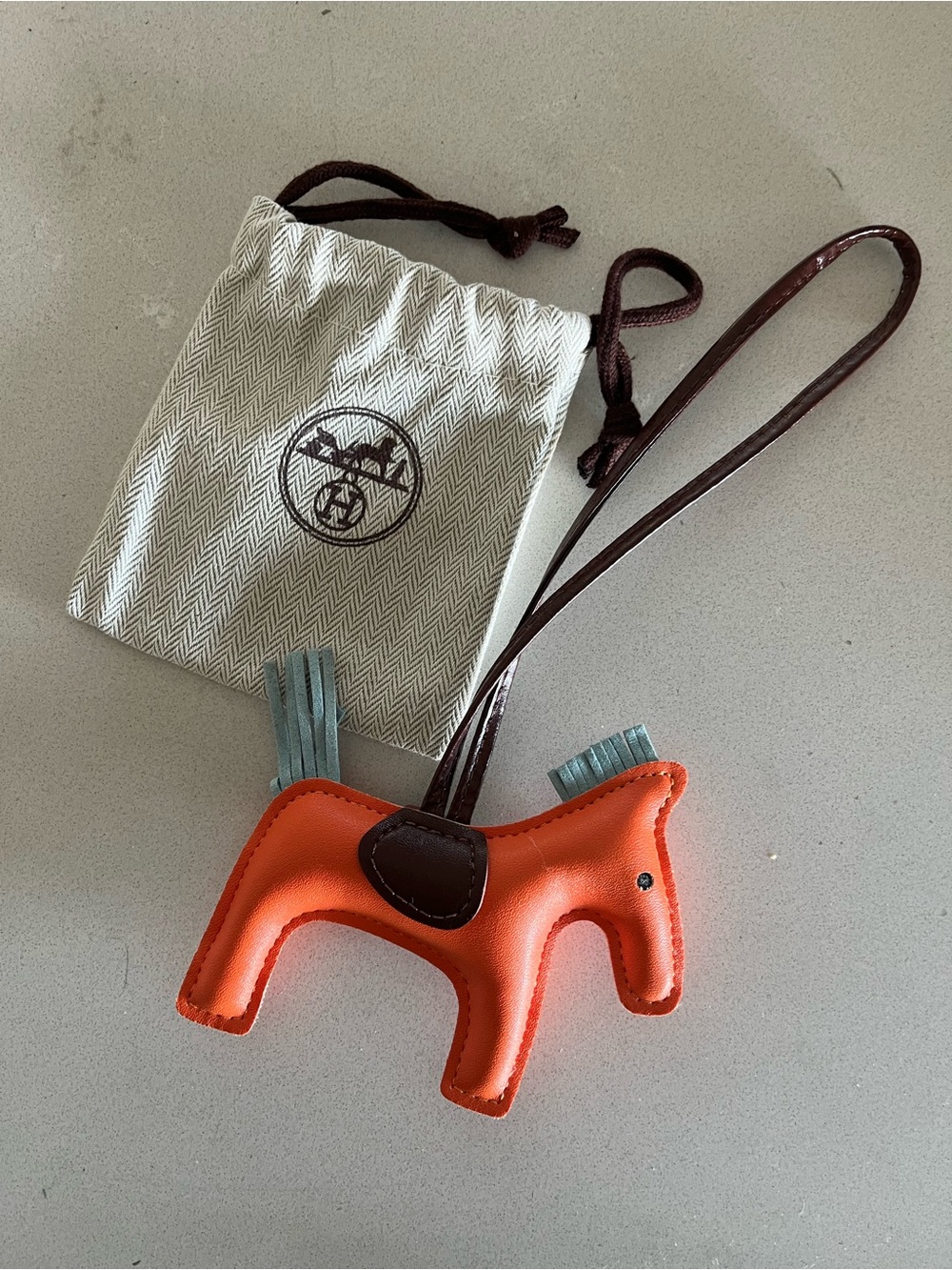 Orange HERMES “H” pouch with **BONUS** Orange Horse Bag Charm